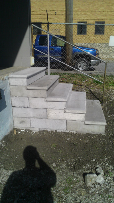 A freshly made brick stair on the outside of a house